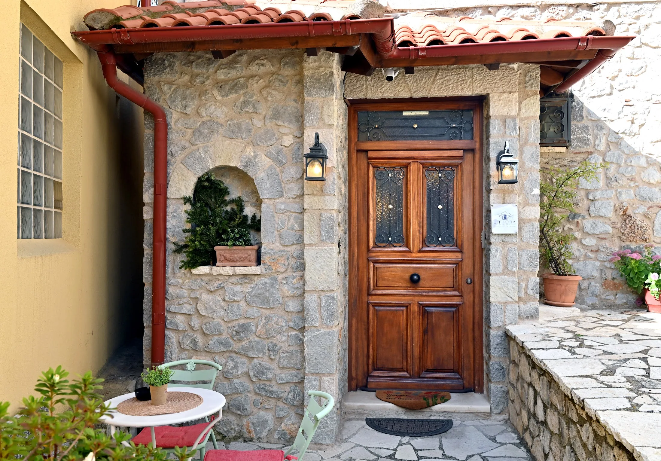 Lithora stone-framed entrance and timber door